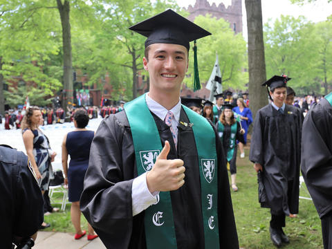 graduate with thumb up
