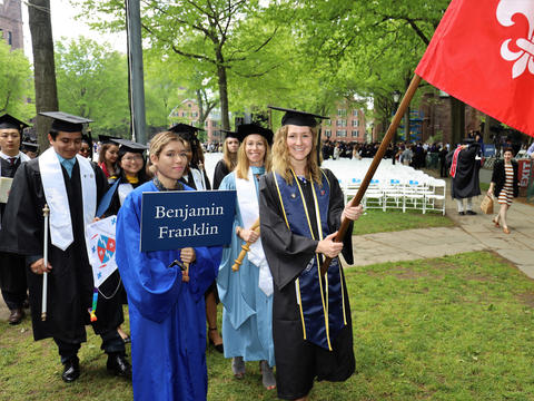 graduates marching in from benjamin franklin college