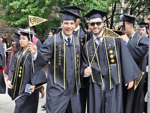 graduates with pierson flag