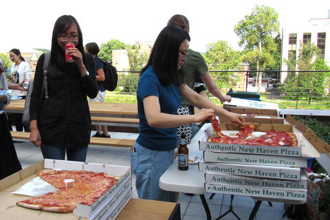 guests enjoying pizza and drinks