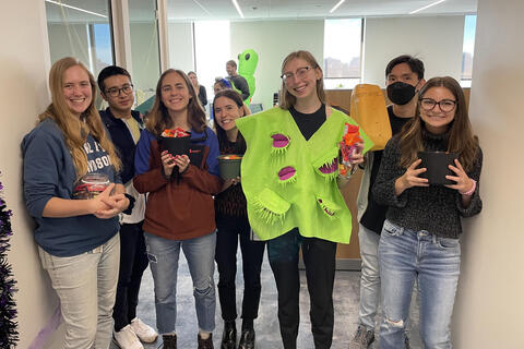 group of 7 one wearing venus fly trap costume