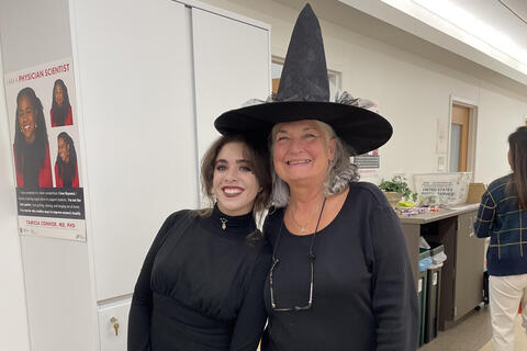 two people dressed as witches