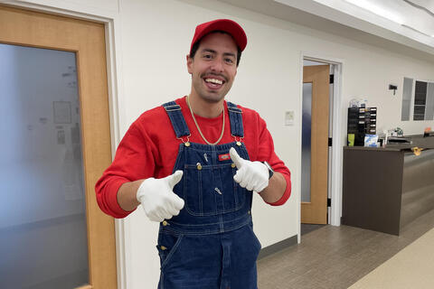 person dressed up as mario from mario brothers