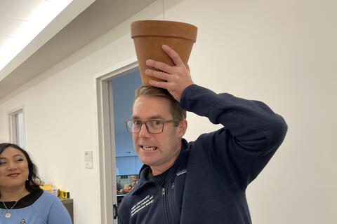 person with a pot on his head 