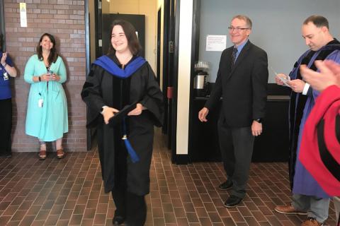 Shira Stav smiles after hooding from Ronald Breaker. (Photo by Denise George)